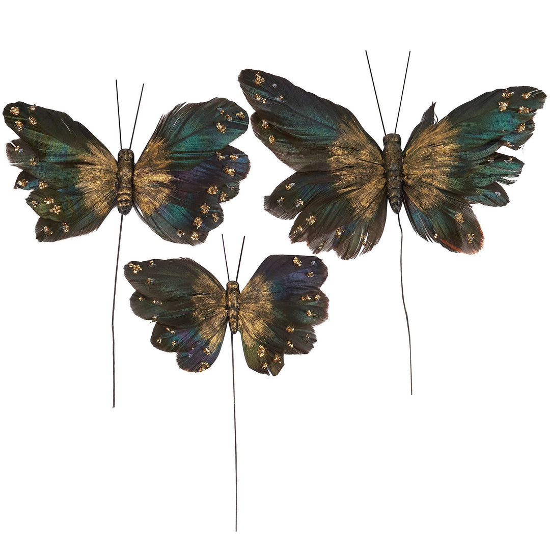 Chic Collective Moody Butterfly Pick Set features three decorative butterflies in dark green, blue, and gold with glitter and feather details on wires.