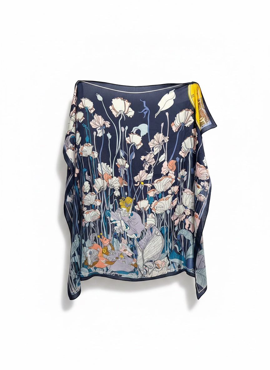 Chic Collective Moonlit Meadow Scarf with ivory and blush florals on navy, featuring woodland details and figures. Ethereal elegance.