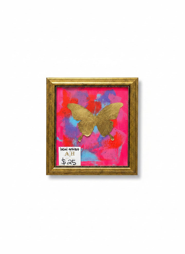 Chic Collective Neon Flutter framed abstract art with gold butterfly on hot pink, coral, violet, and blue background.