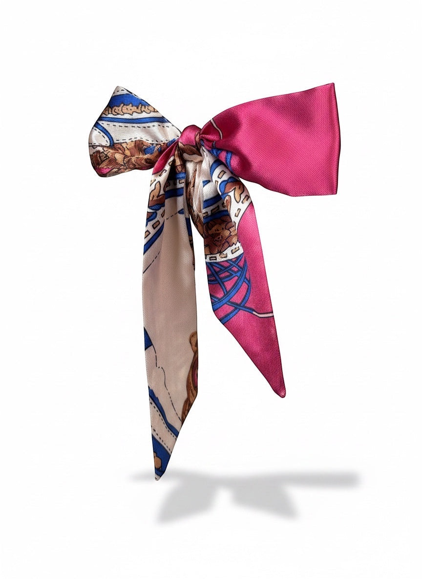 Chic Collective Parisian Jewel Ribbon Tie: Magenta satin ribbon with scarf print in cobalt, camel, and ivory. Versatile accessory.