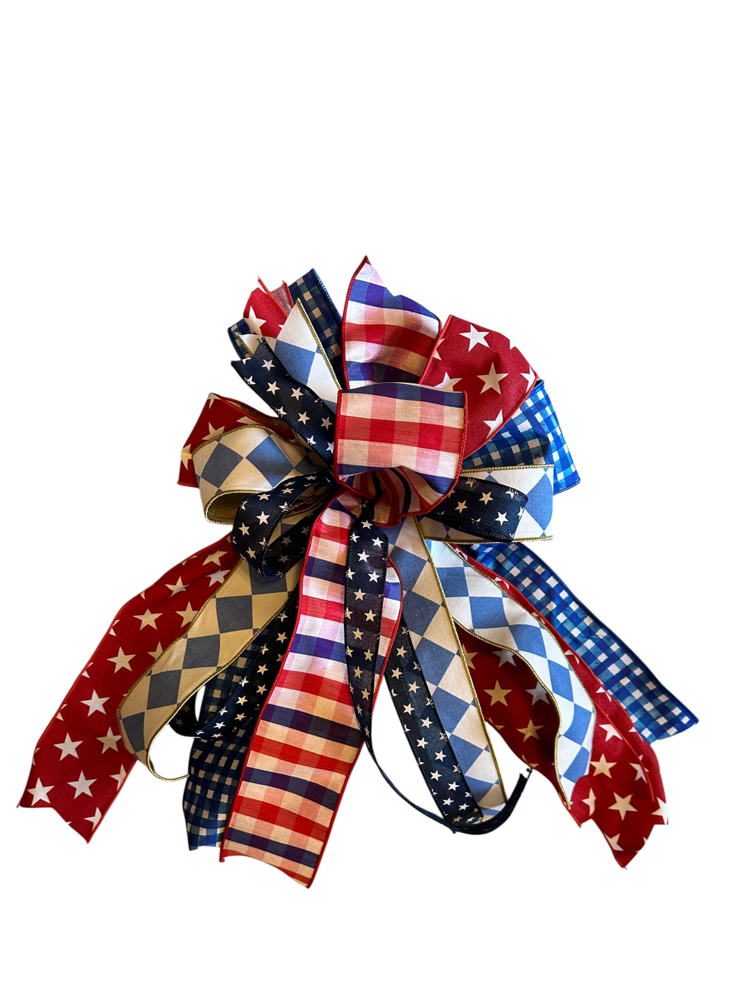Chic Collective patriotic decorative bow with red, white, and blue stars, stripes, gingham, and diamond patterns.