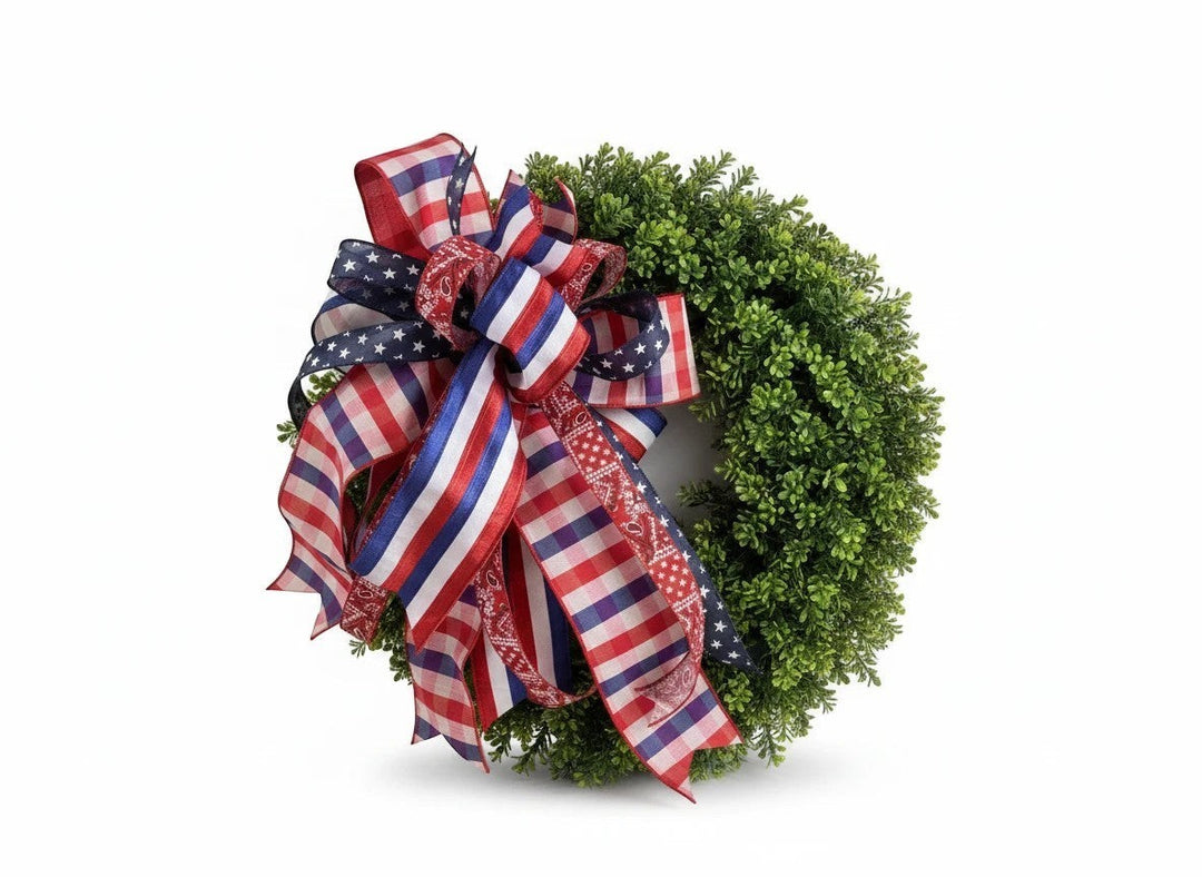 Chic Collective patriotic boxwood wreath with red, white, and blue ribbon bow featuring stars and stripes patterns.