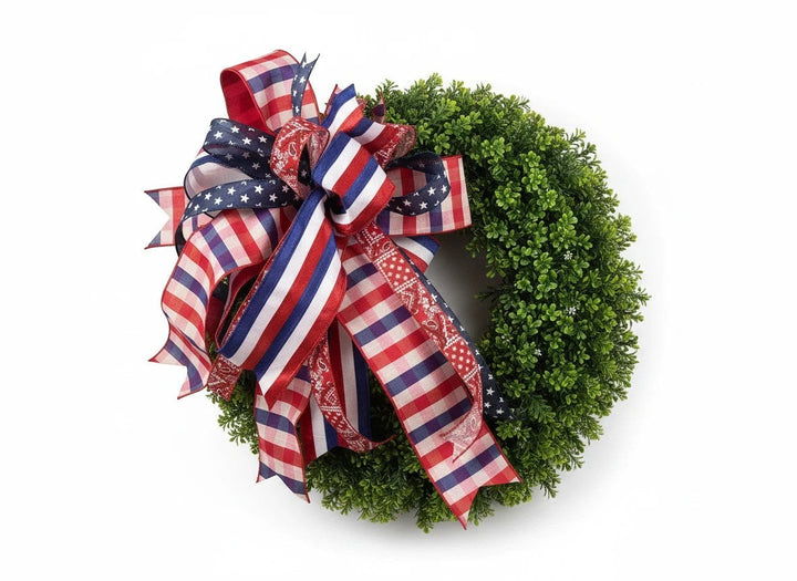 Chic Collective patriotic boxwood wreath with red, white, and blue striped, gingham, star, and bandana print ribbons.