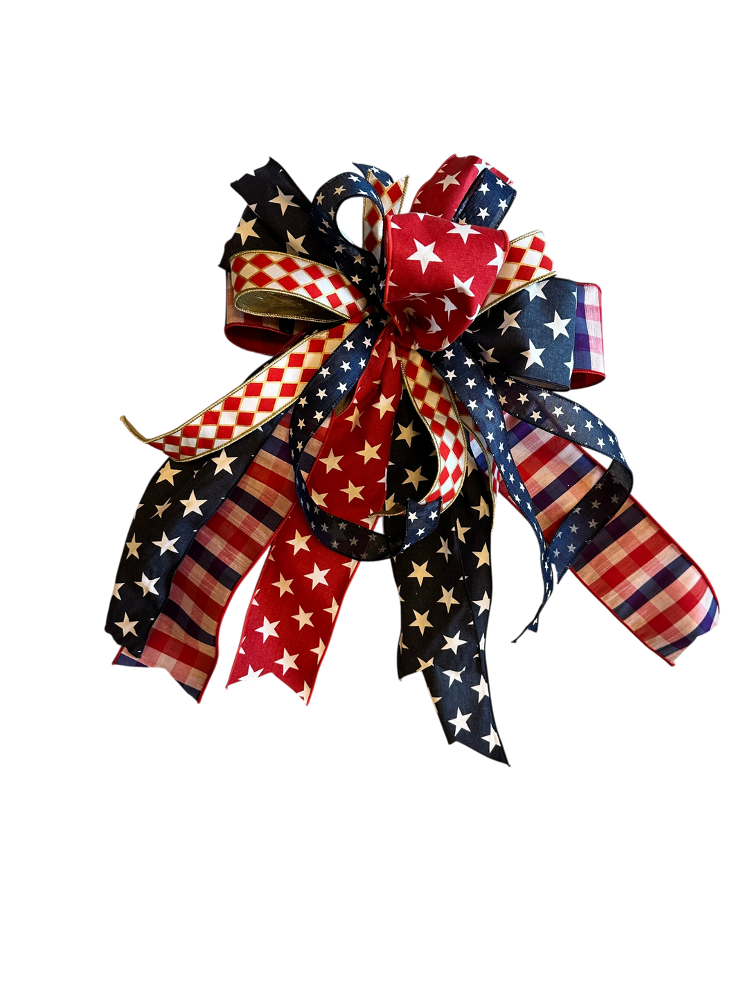 Chic Collective patriotic bow decoration with red, white, and blue ribbons featuring stars, stripes, and checkered patterns.