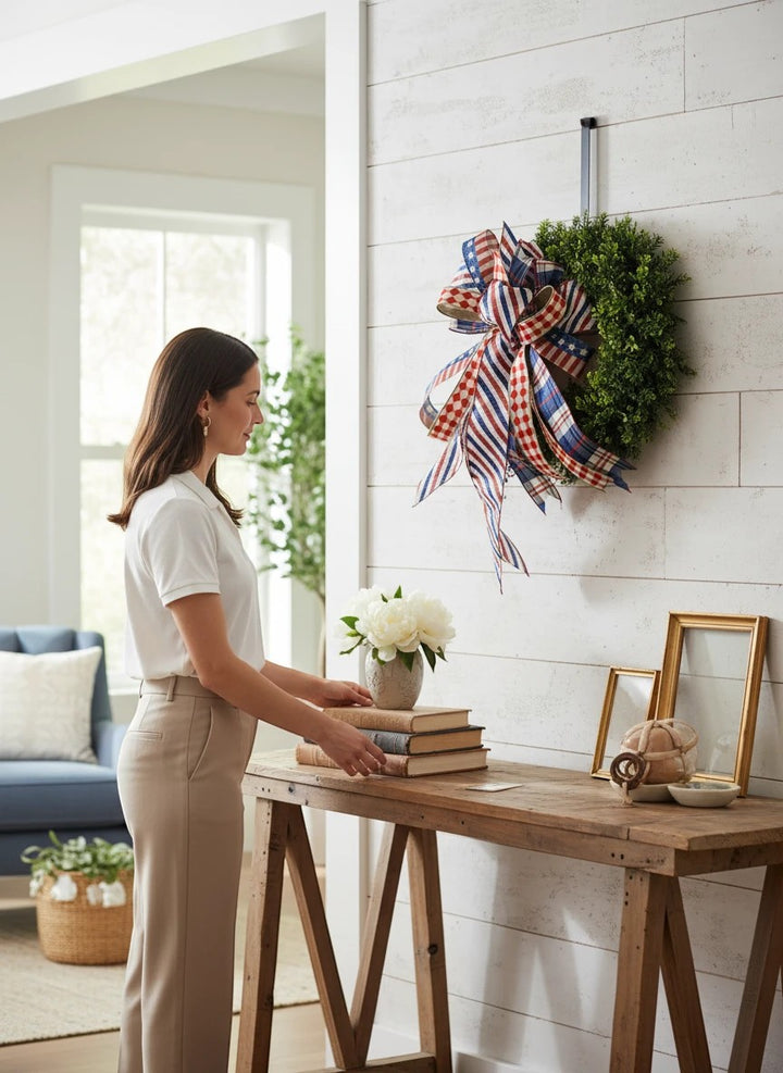 Chic Collective patriotic red, white, and blue ribbon bow decoration on a green wreath with stars and stripes.