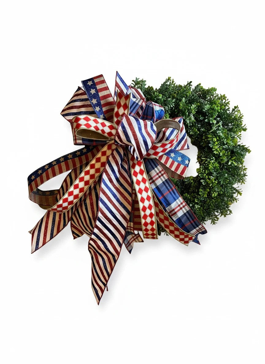 Chic Collective patriotic wreath decoration with red, white, and blue striped, plaid, and star ribbon bow.