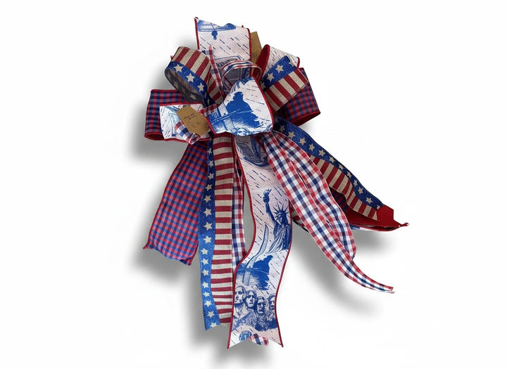 Chic Collective patriotic ribbon bow with red, white, and blue stars, stripes, gingham, and national monument prints.
