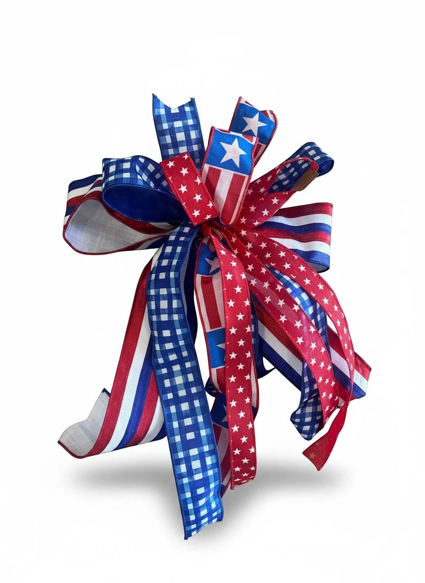 Chic Collective patriotic ribbon bow featuring red, white, and blue gingham, striped, and star patterns for decor.
