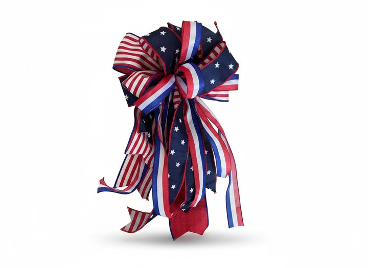 Chic Collective patriotic ribbon bow with red, white, and blue star and stripe patterns for holiday decor.