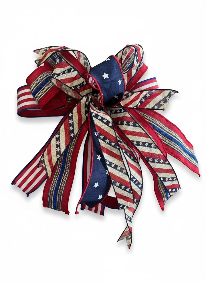 Chic Collective patriotic ribbon bow with red, white, and blue stars and stripes patterns for seasonal home decor.