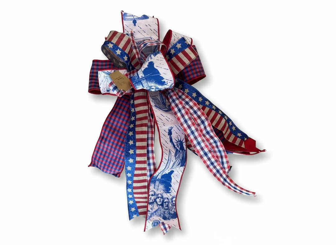 Chic Collective patriotic ribbon bow with red, white, and blue stars, stripes, and iconic American landmark prints.
