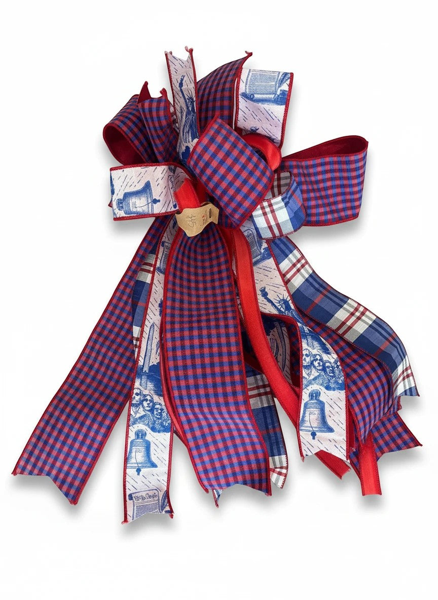 Chic Collective patriotic ribbon bow with red, white, and blue plaid and American monument print for holiday decor.