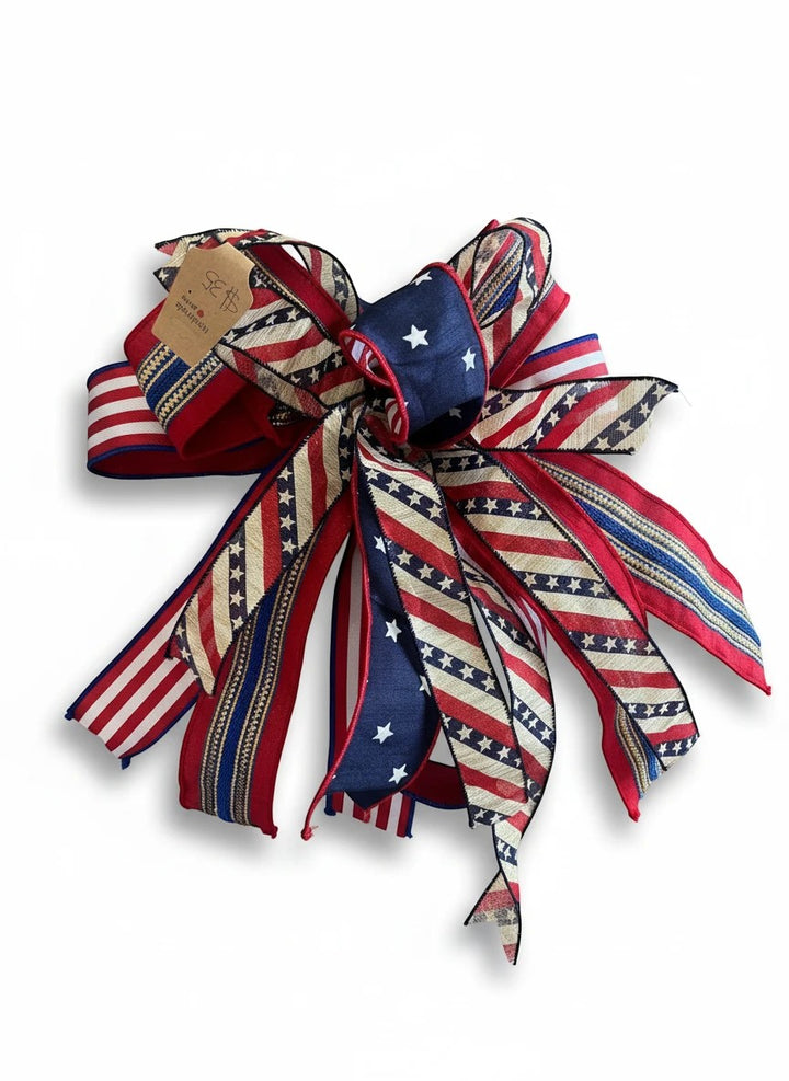 Chic Collective patriotic ribbon bow with red, white, and blue stars and stripes patterns for seasonal home decor.