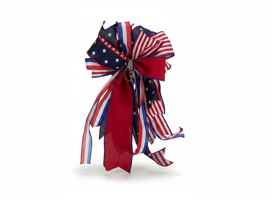 Chic Collective patriotic ribbon bow with red, white, and blue star and stripe patterns for holiday decor.