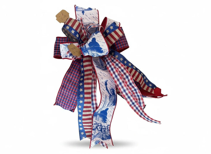 Chic Collective patriotic ribbon bow with red, white, and blue stars, stripes, Statue of Liberty, and gingham patterns.