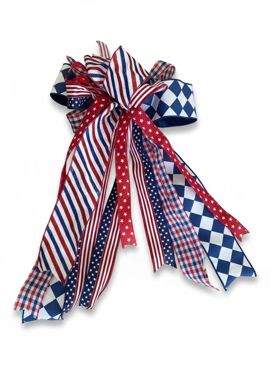 Chic Collective patriotic ribbon bow with red, white, and blue stripes, stars, gingham, and diamond patterns.