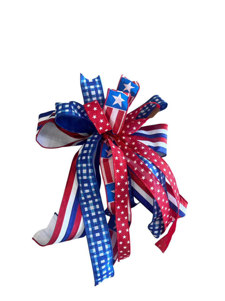 Chic Collective patriotic ribbon bow featuring red, white, and blue gingham, striped, and star patterns for decor.