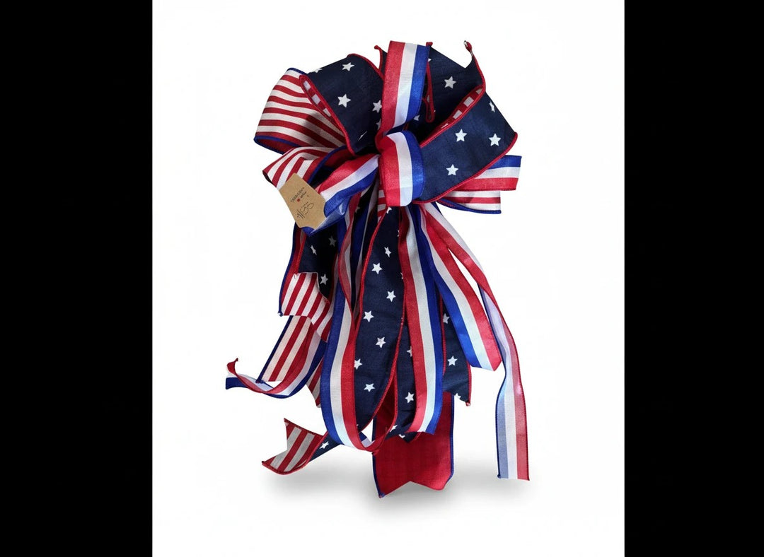 Chic Collective patriotic ribbon bow with red, white, and blue stars and stripes for holiday wreath decor.