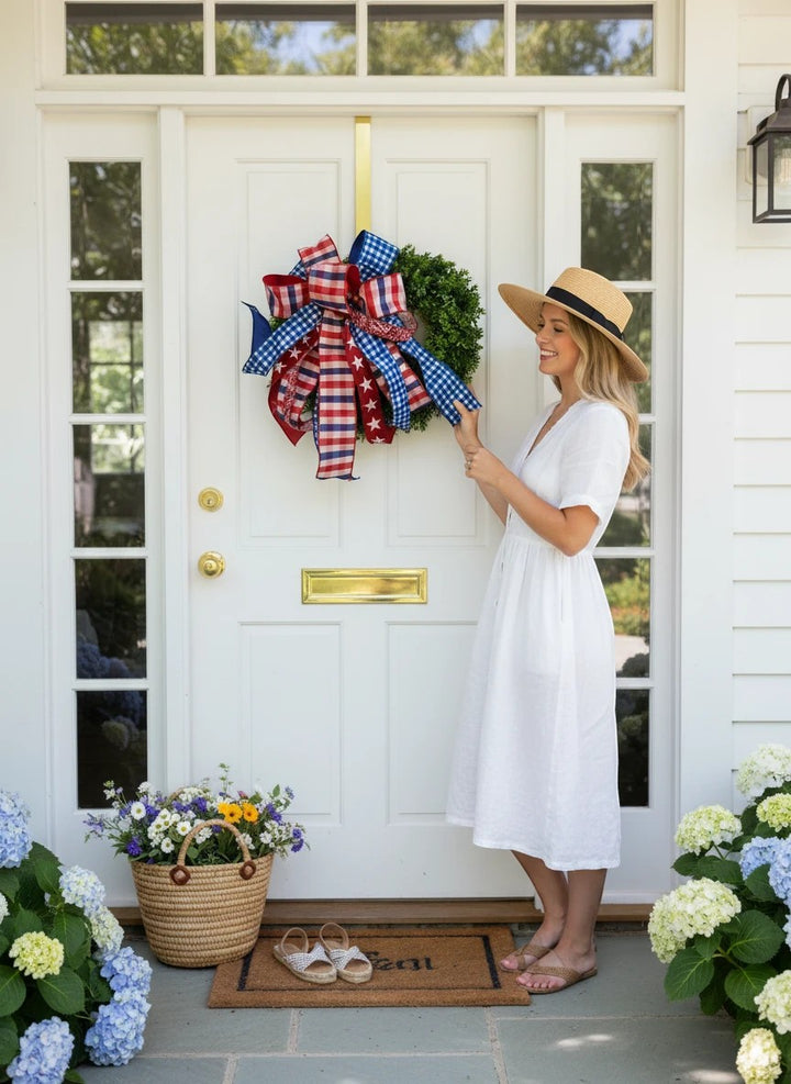 Chic Collective patriotic ribbon wreath bow with red, white, and blue gingham and stars. Wired edges for shaping.