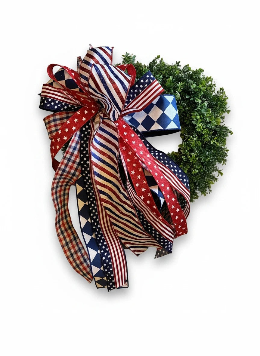 Chic Collective patriotic wreath with red, white, and blue ribbon bow featuring stars, stripes, and checkered patterns.
