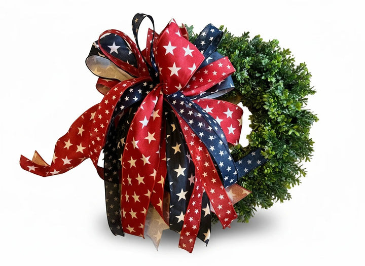 Chic Collective Patriotic Star Ribbon Wreath Decoration with red, white, and blue ribbons featuring white stars.