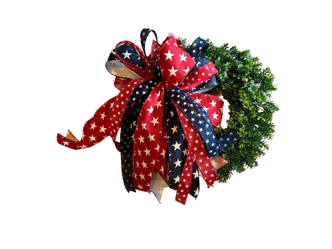 Chic Collective Patriotic Star Ribbon Wreath Decoration with red, white, and blue ribbons featuring white stars.