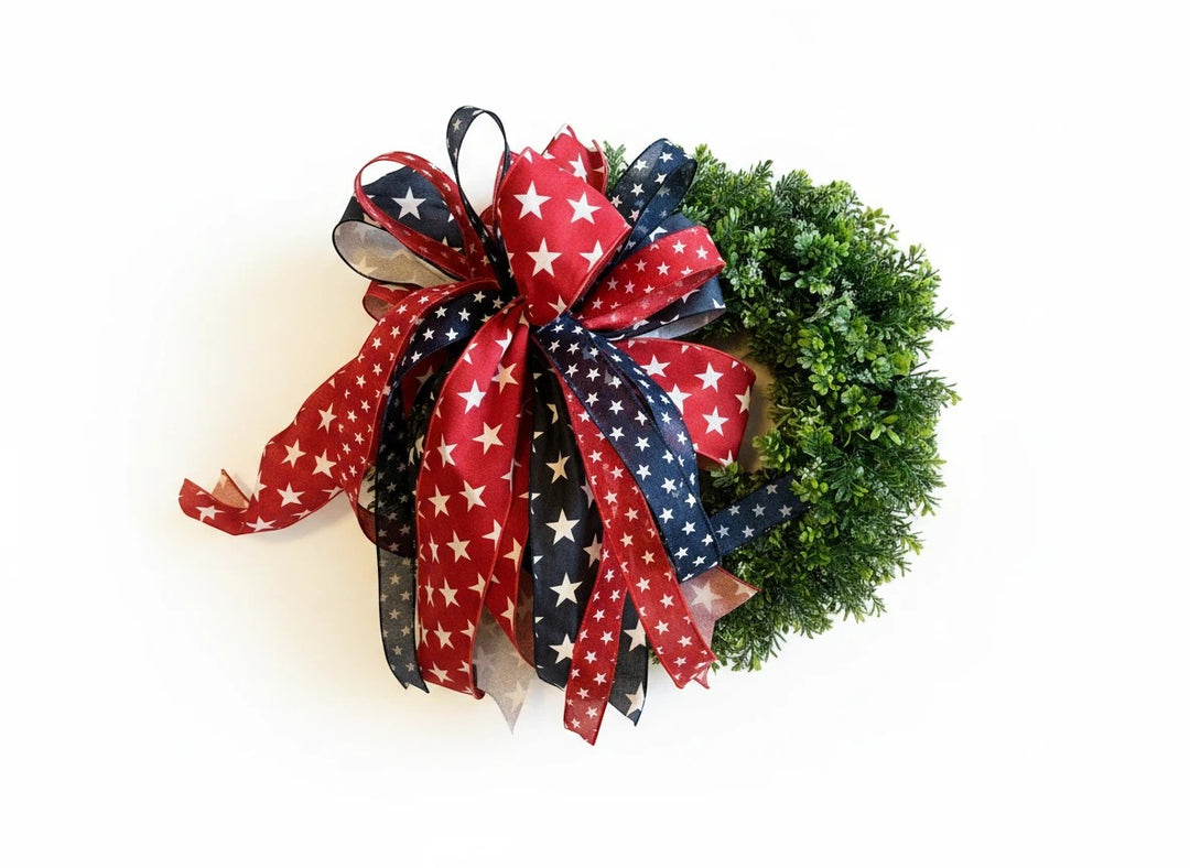 Chic Collective Patriotic Star Ribbon Wreath Decoration with red, white, and blue ribbons featuring white stars.
