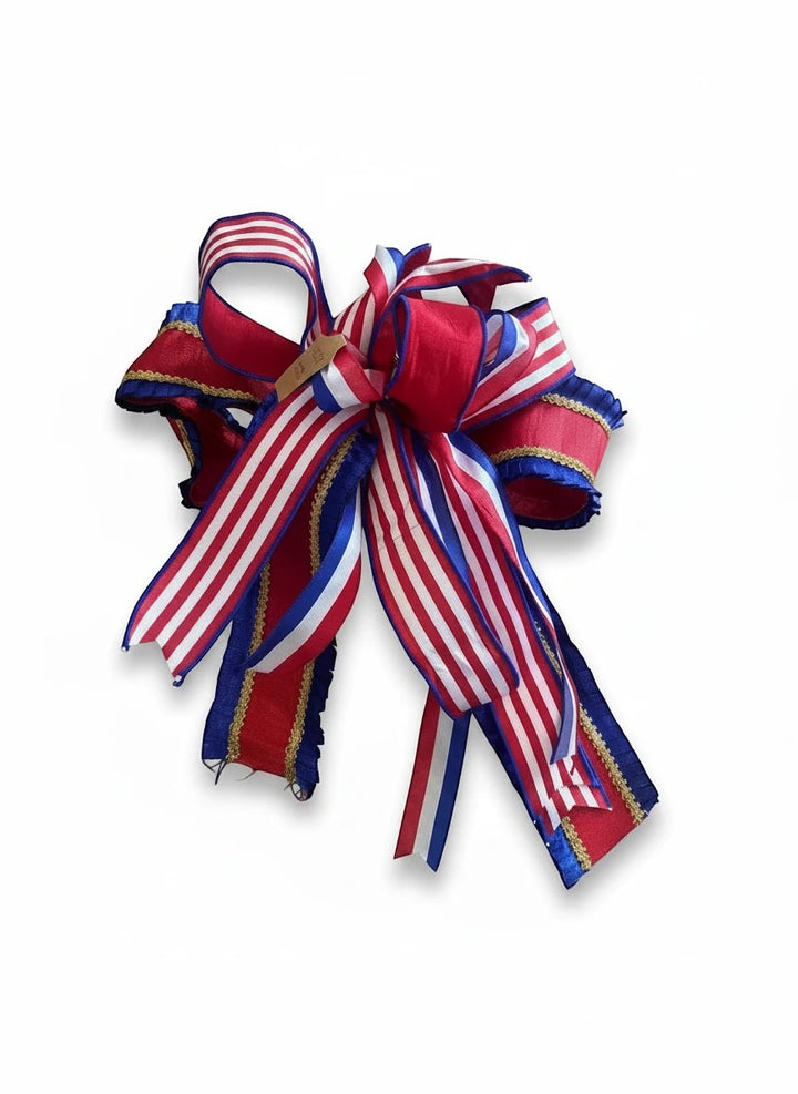 Chic Collective decorative bow in red, white, and blue striped ribbon with gold trim for patriotic holiday decor