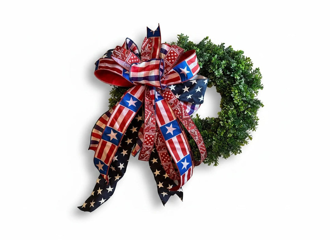Chic Collective patriotic bow with American flag and bandana print ribbons on a green wreath.