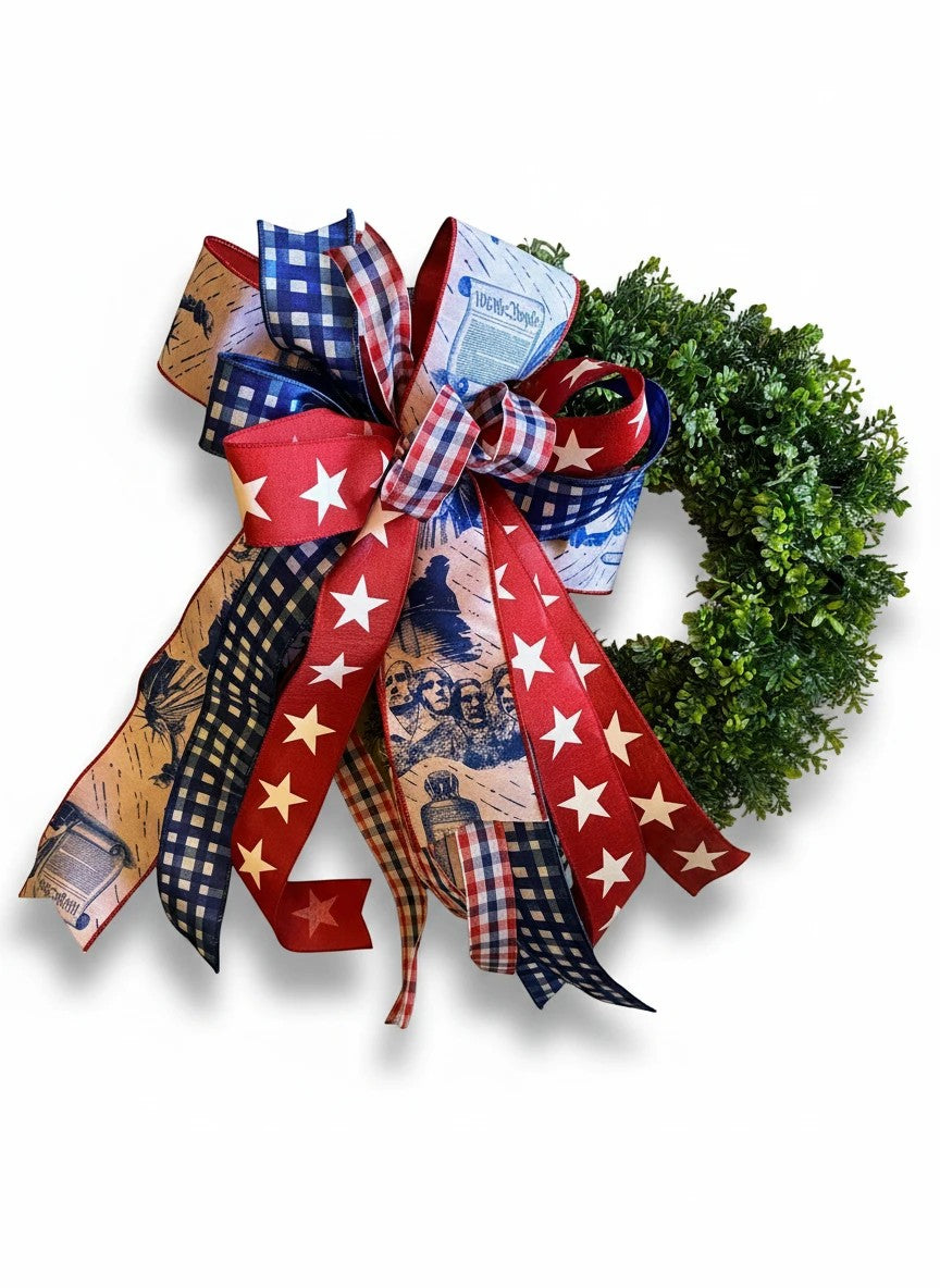 Chic Collective patriotic fabric bow with red, white, and blue gingham, stars, Mount Rushmore, and "We the People" text.