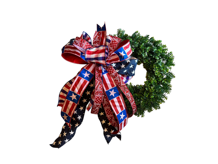 Chic Collective patriotic bow with American flag and bandana print ribbons on a green wreath.