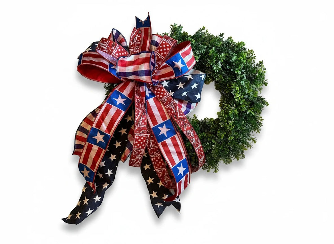 Chic Collective patriotic bow with American flag and bandana print ribbons on a green wreath.