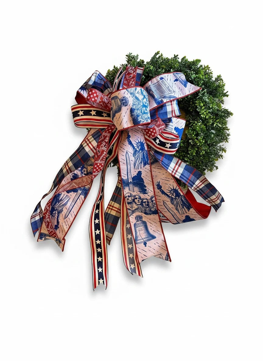 Chic Collective patriotic bow with Statue of Liberty, Mount Rushmore, and Liberty Bell prints on plaid and star ribbons.