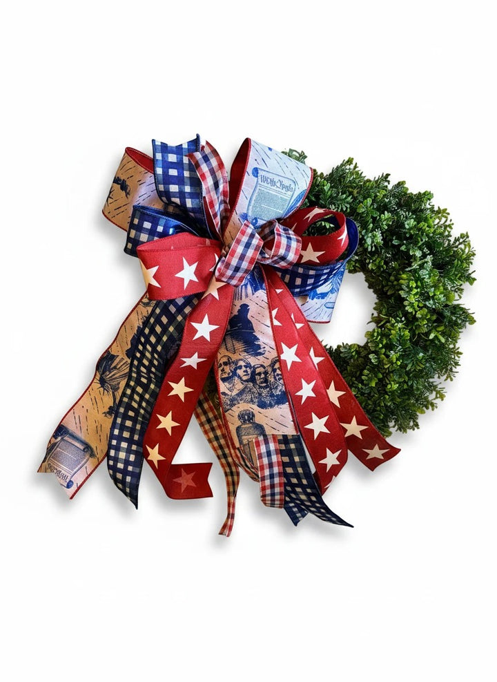 Chic Collective patriotic wreath bow with red, white, and blue ribbons featuring Mount Rushmore, stars, and gingham.