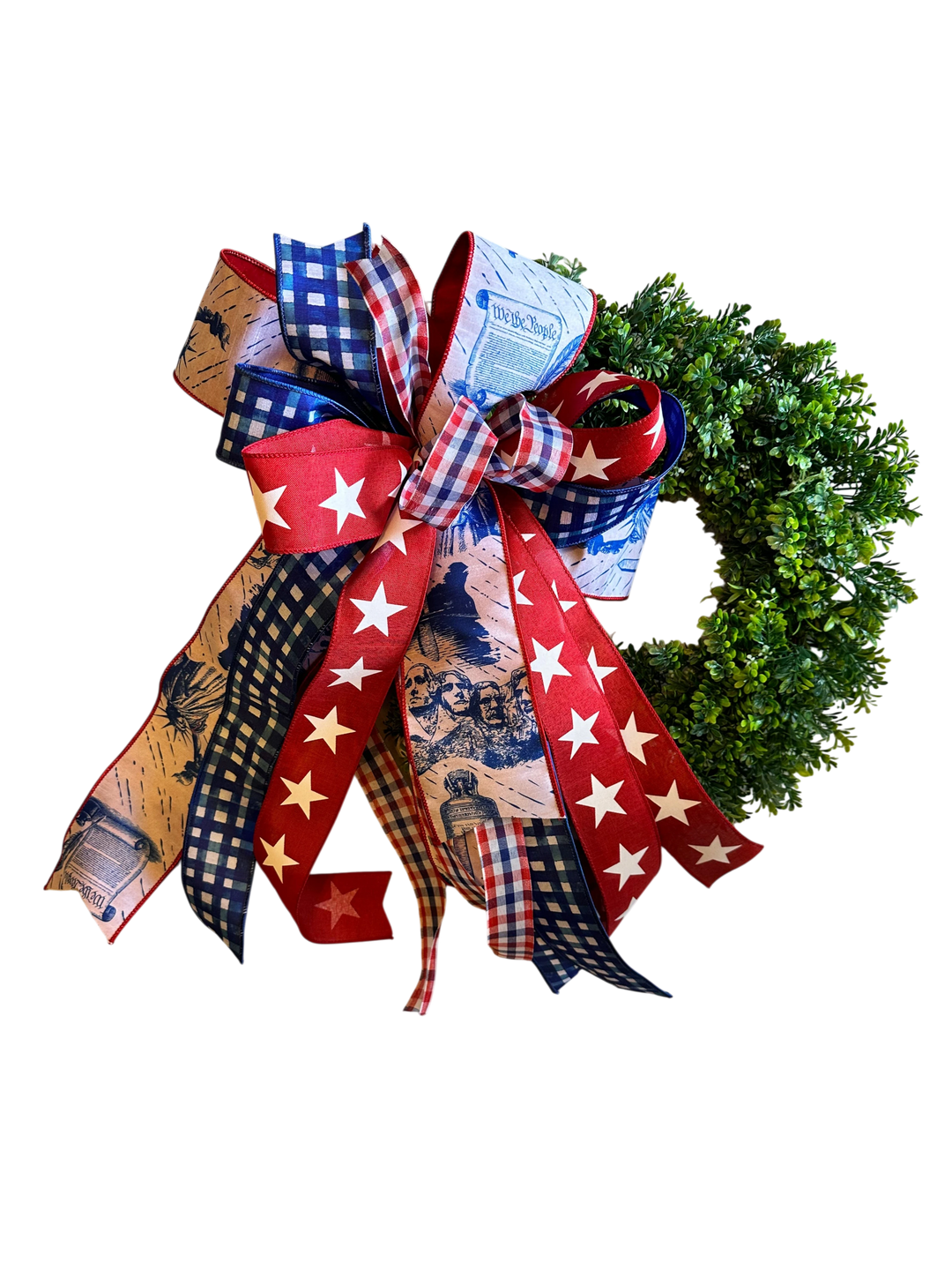 Chic Collective patriotic wreath bow with red, white, and blue ribbons featuring "We the People" text, Mount Rushmore, and stars.