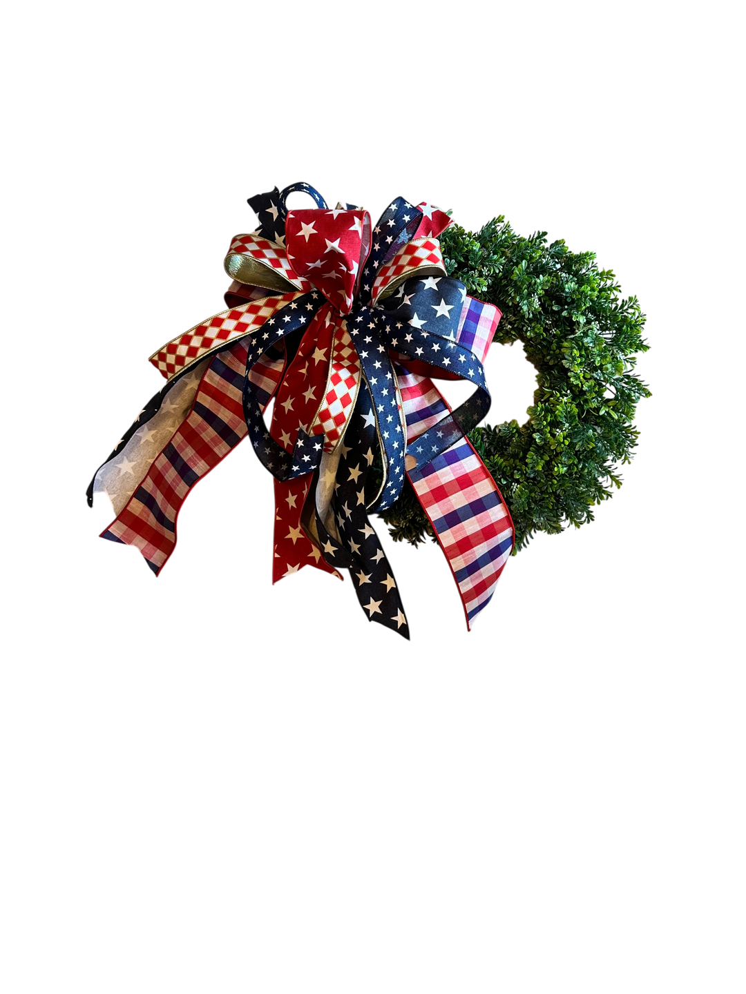 Chic Collective patriotic wreath with red, white, and blue star, stripe, and checkered ribbon bow on a lush green base.
