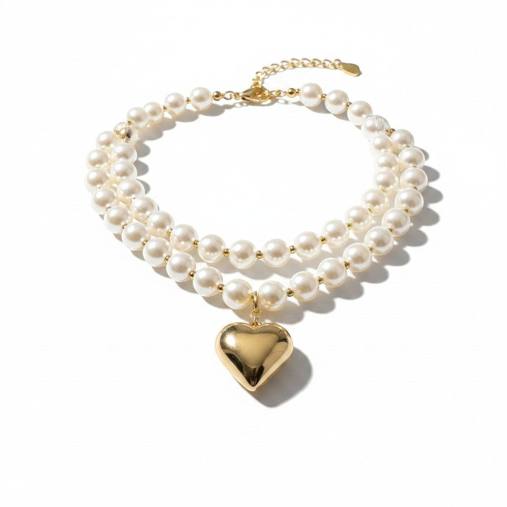 Chic Collective double-strand pearl necklace with a gold-tone heart charm.