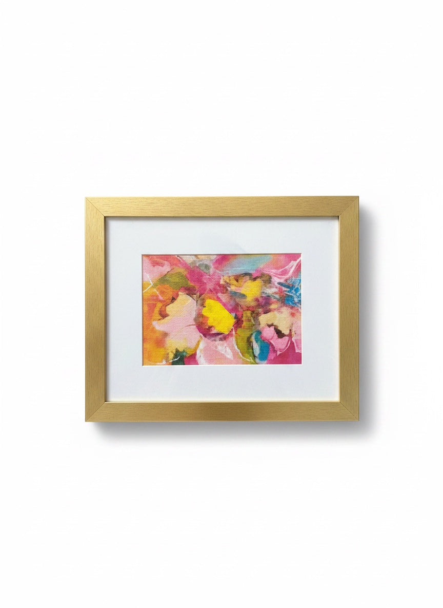 Chic Collective Petals in Motion abstract floral art with pink, yellow, coral, turquoise, and peach hues in a gold frame.
