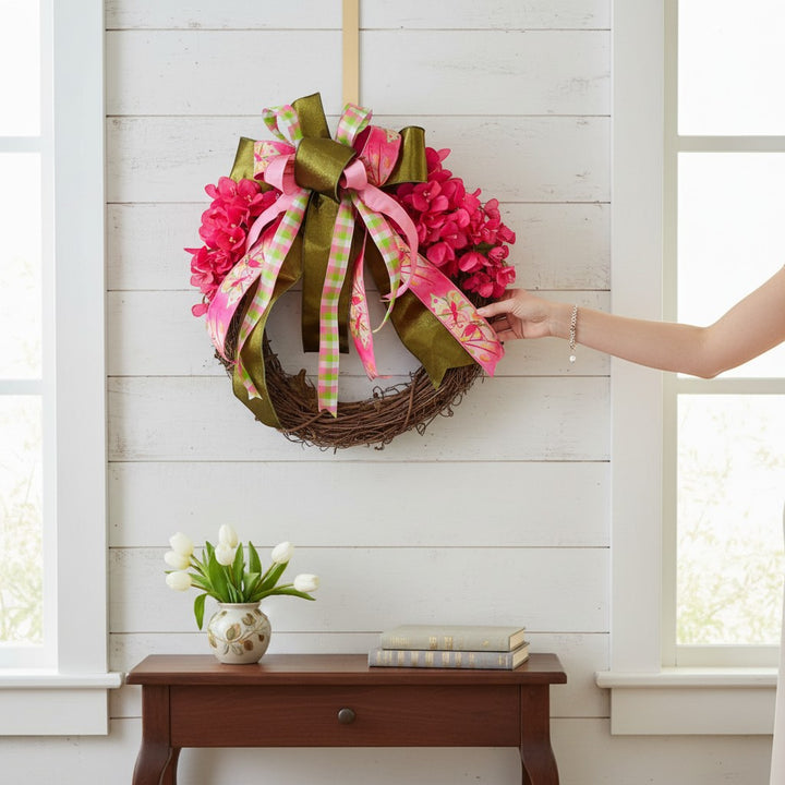 Chic Collective 24-inch grapevine wreath with bright pink flowers and green/pink plaid and floral ribbons.