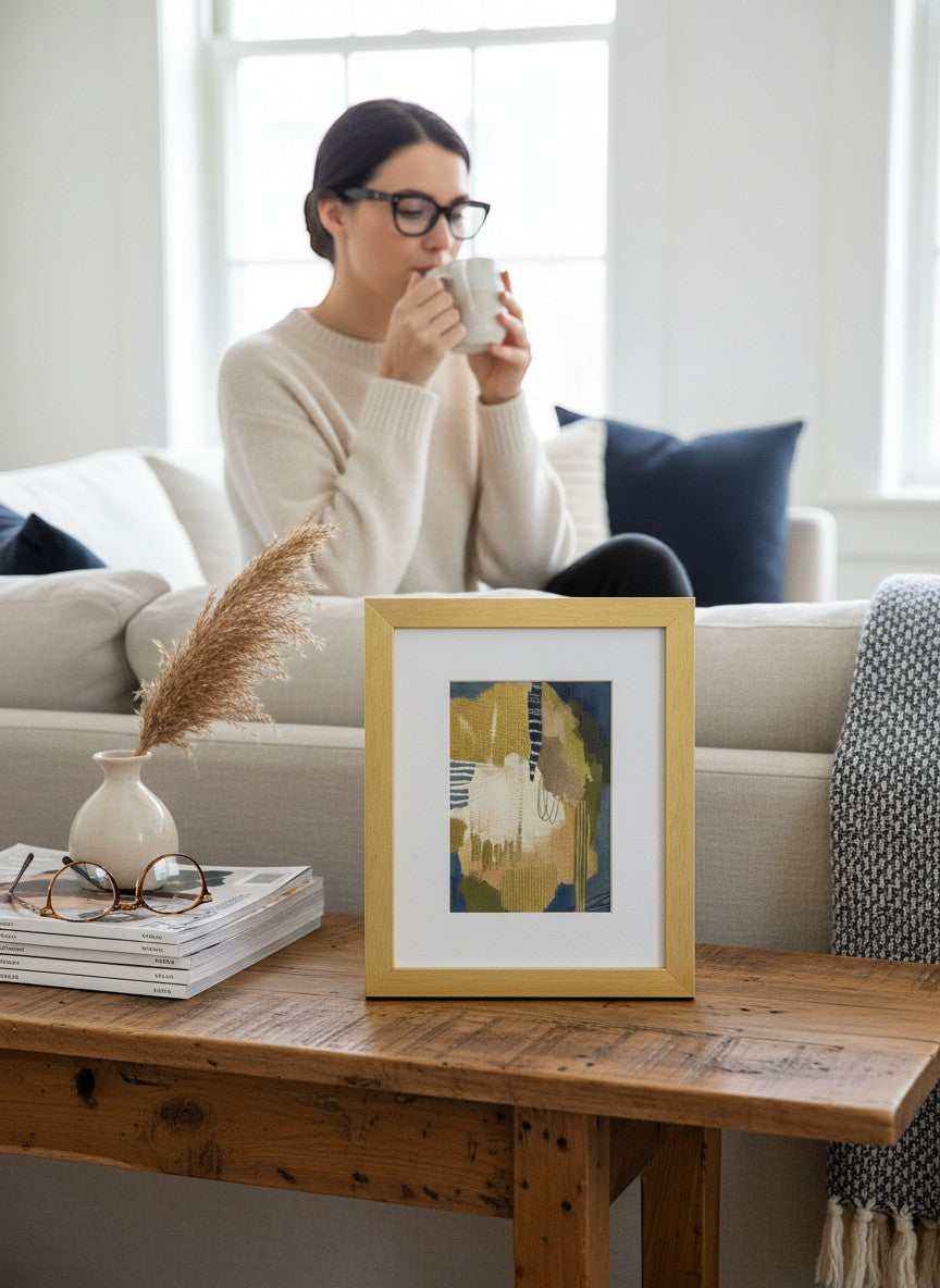 Chic Collective Quiet Composition abstract art print with olive, sand, cream, and navy tones in a gold frame.