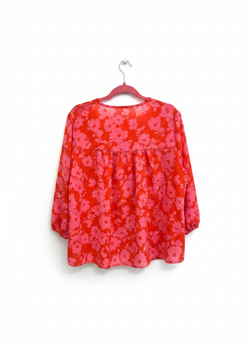 Chic Collective red and pink floral print tie-neck blouse with 3/4 sleeves.