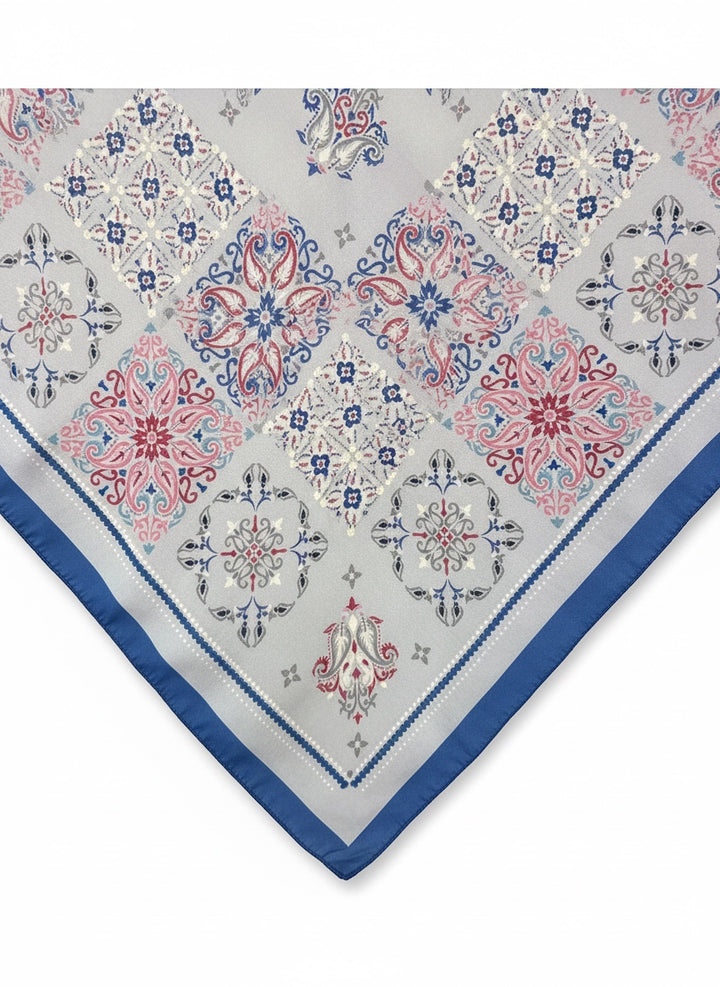 Chic Collective Santorini Tile Scarf with blue, pink, and gray ornamental motifs on ivory.