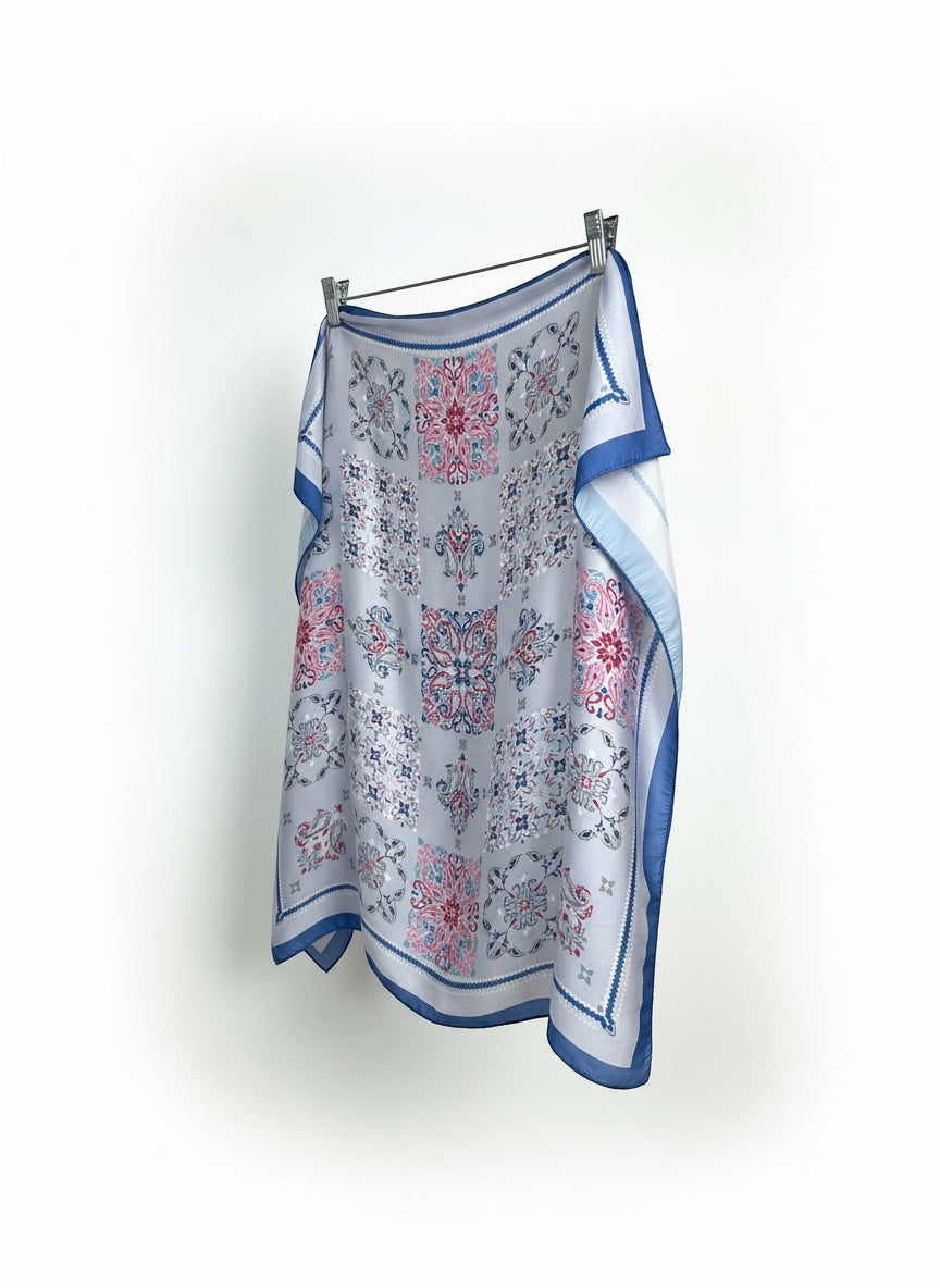 Chic Collective Santorini Tile Scarf in ivory with blue, pink, and gray ornamental motifs. Lightweight fabric.