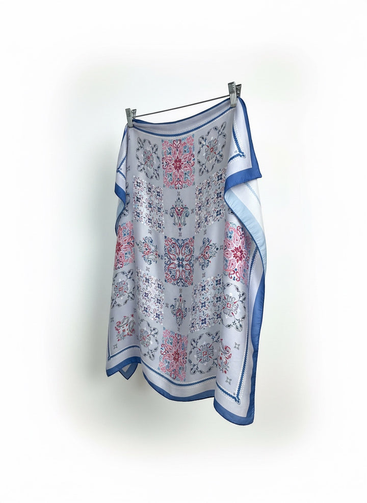 Chic Collective Santorini Tile Scarf in ivory with blue, pink, and gray ornamental motifs. Lightweight fabric.