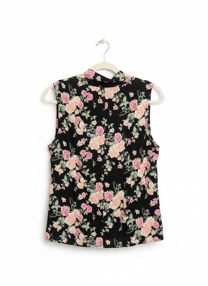 Chic Collective sleeveless black blouse with pink and peach floral print and cowl neckline.