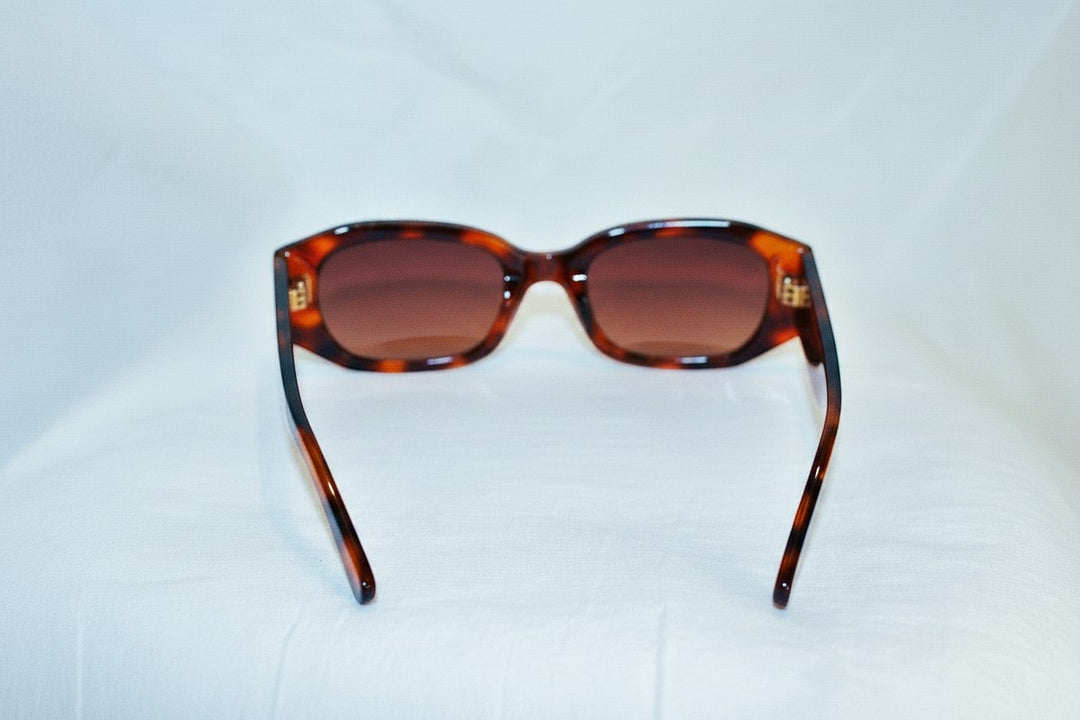 Chic Collective geometric frame sunglasses in tortoise shell pattern with gradient brown lenses and gold accents.