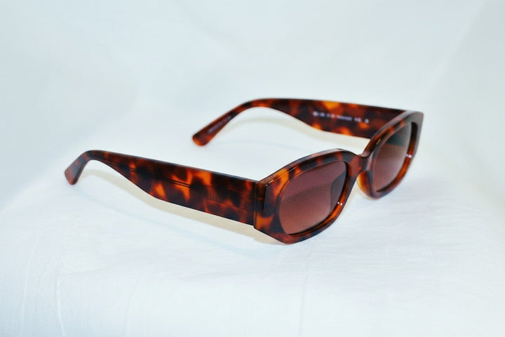 Chic Collective geometric frame sunglasses in tortoise shell acetate with gradient brown lenses.