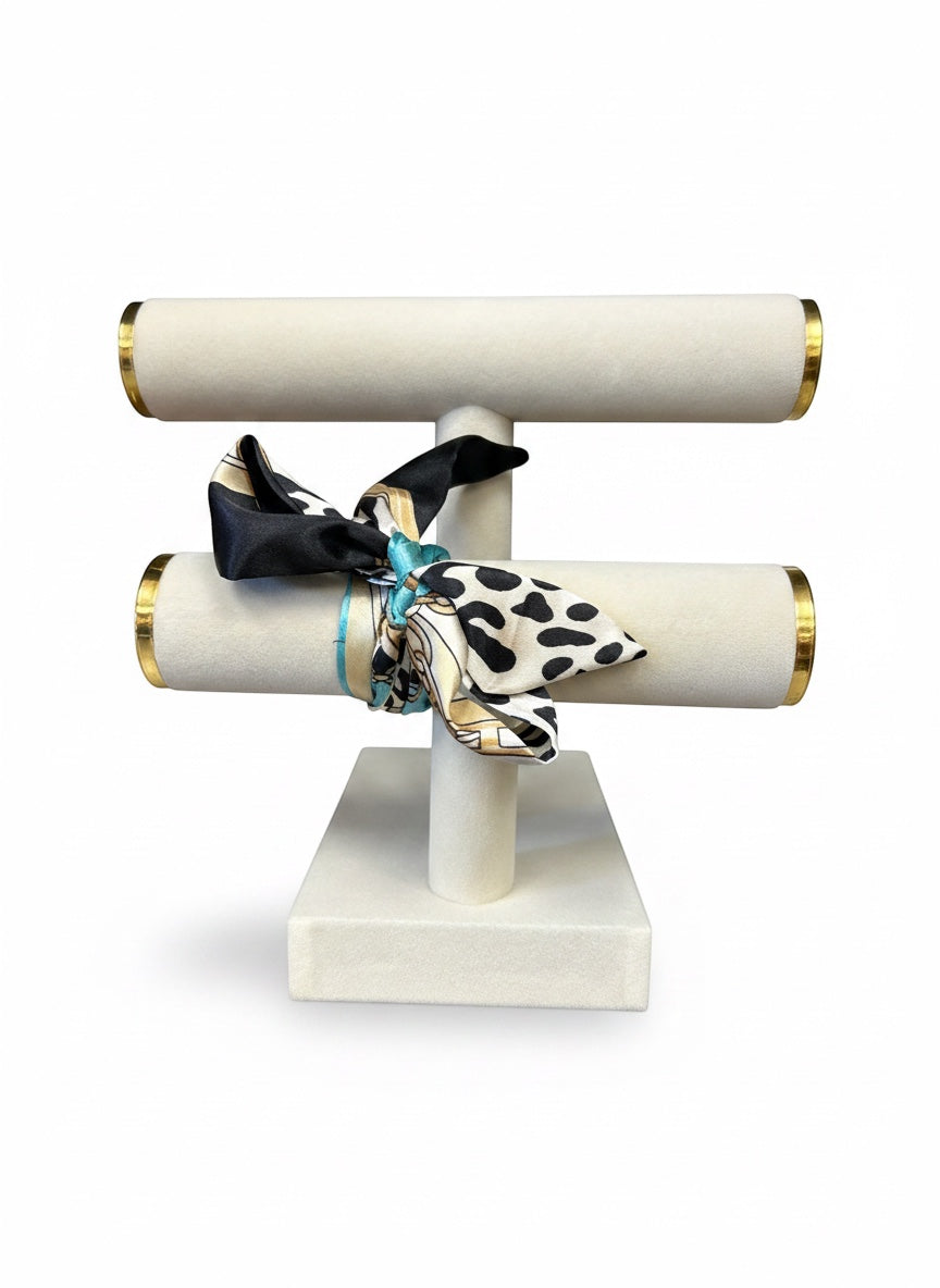 Chic Collective Uptown Wild Tie Scarf: black, white, and turquoise animal print silk scarf with gold chain accents.
