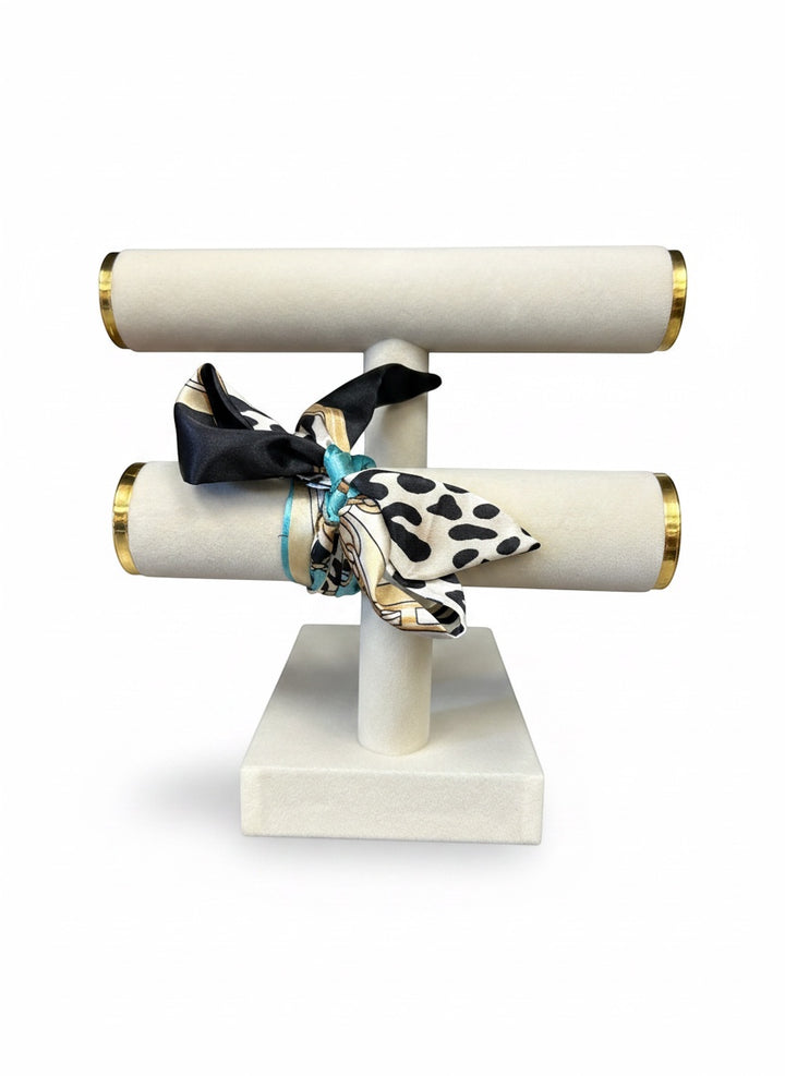 Chic Collective Uptown Wild Tie Scarf: black, white, and turquoise animal print silk scarf with gold chain accents.