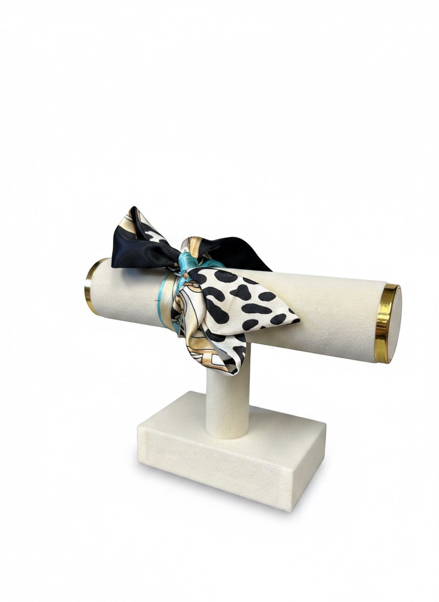 Chic Collective Uptown Wild Tie Scarf: black, white, and turquoise animal print silk scarf with gold chain accents.
